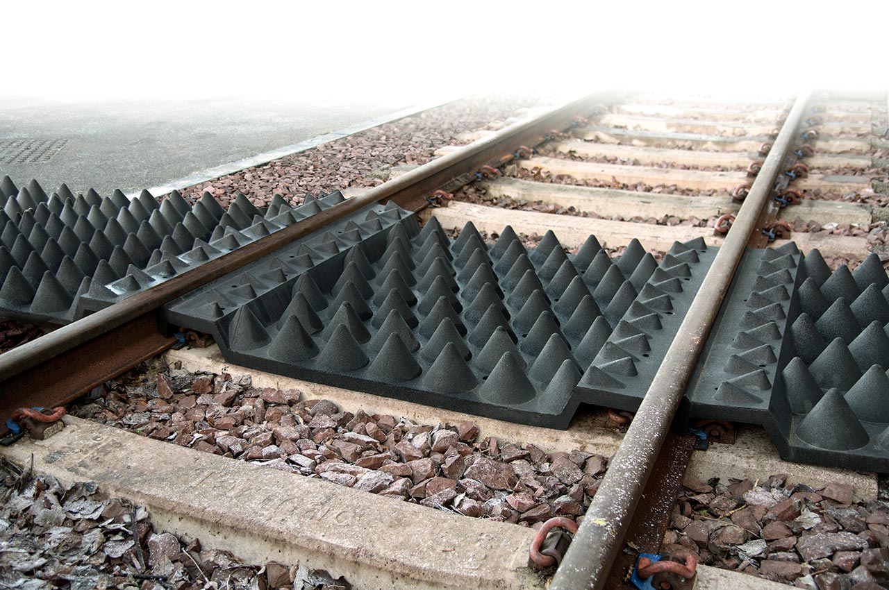 Anti-trespass panels in-track installation