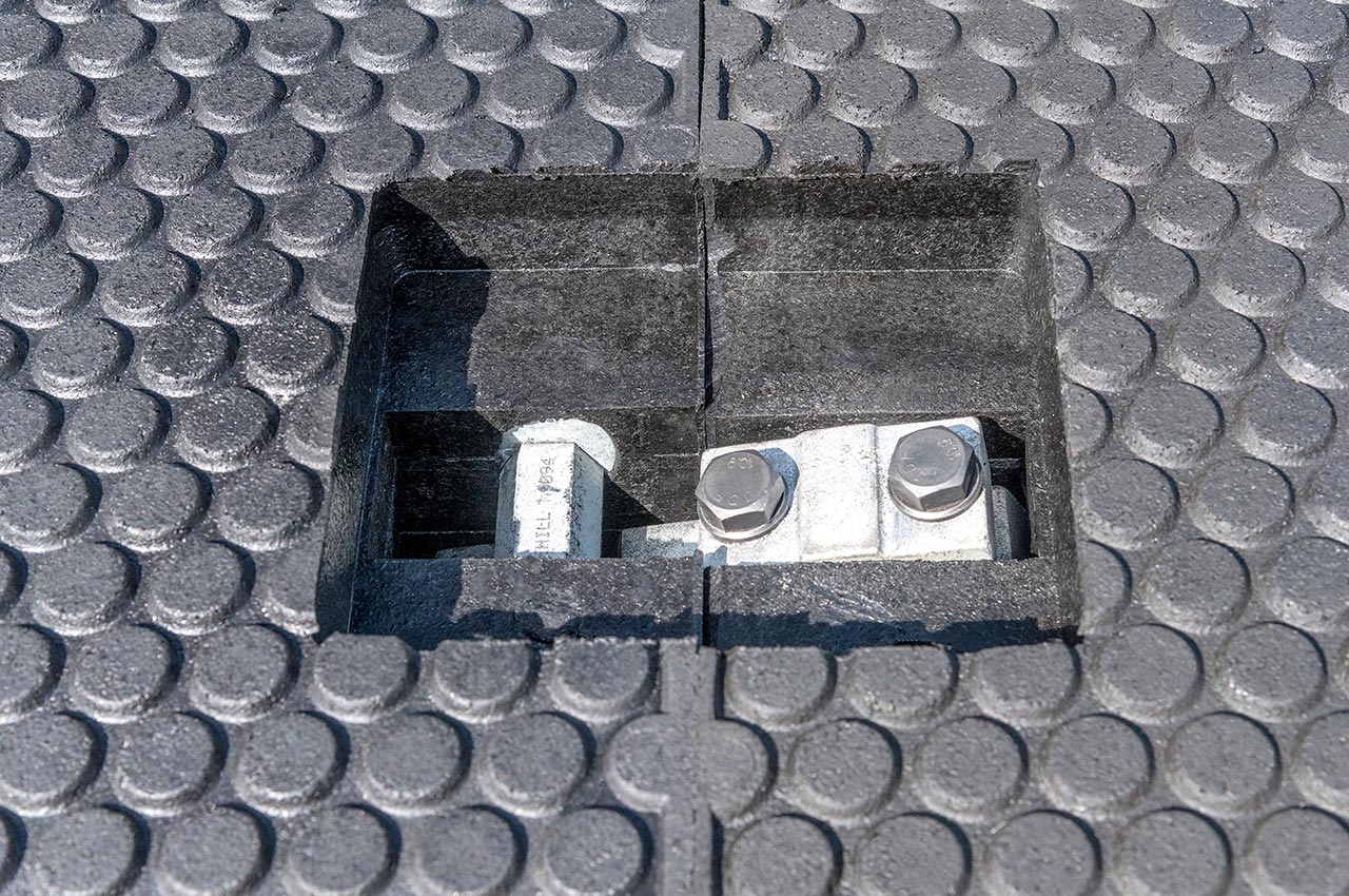 Panel fixings recessed into crossing surface