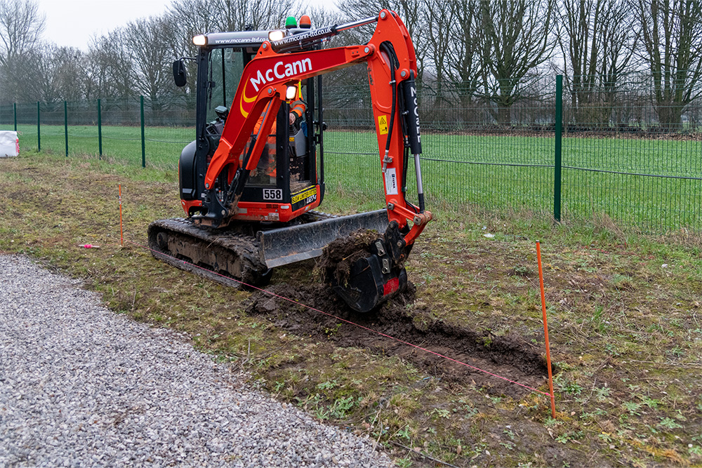 Excavator preparing walkway route
