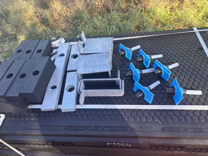 Installation crew positioning StrandLock panels on the track