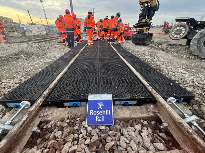 Completed StrandLock crossing with Rosehill Rail branding and installation crew