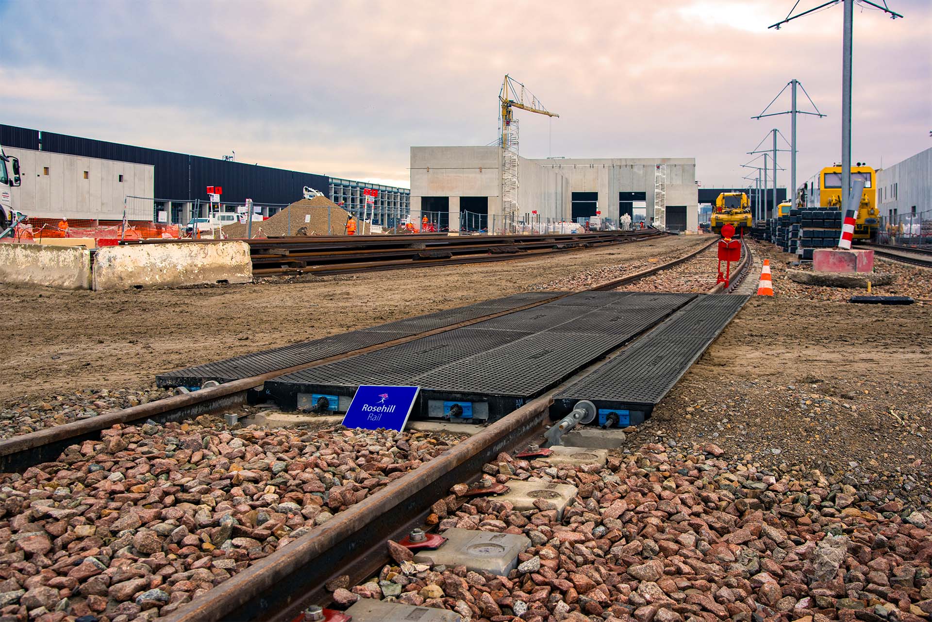 Completed StrandLock level crossing installation at Paris rail depot showing the unified structure with Rosehill Rail branding